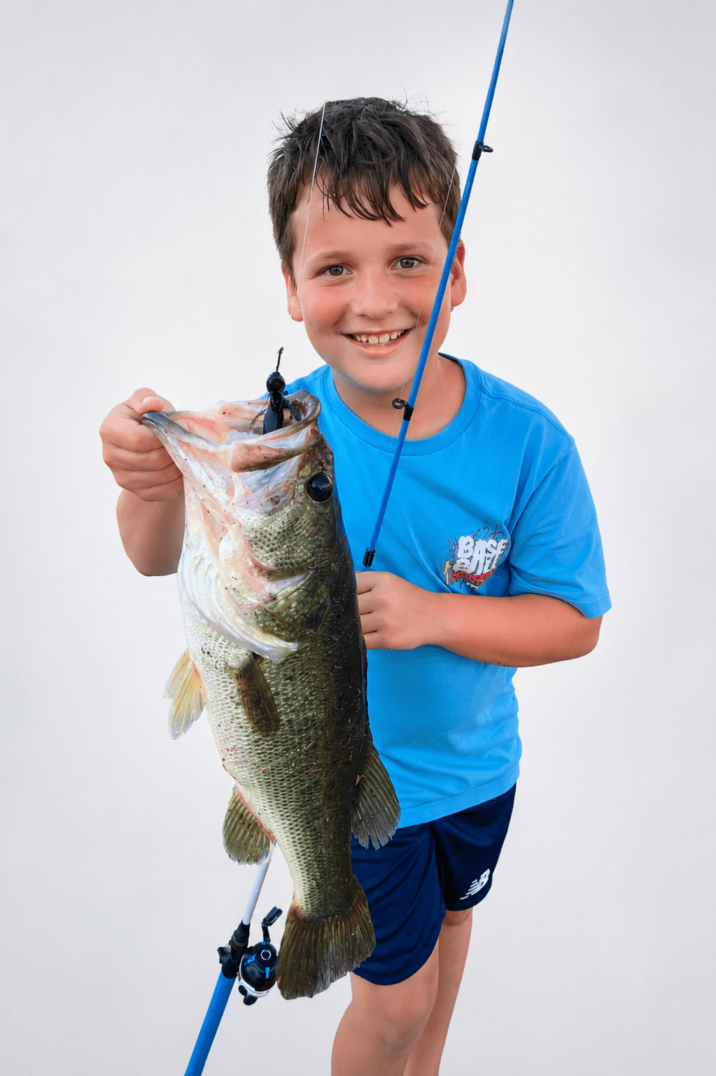 Original photo of a young angler holding a bass